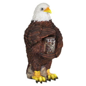 Solar Eagle Garden Statue Holding a Glass Jar with 9 Red White and Blue LED Firefly String Lights, 7.5 x 12.5 Inch | Exhart