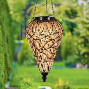 Solar Tear Shaped Amber Glass and Metal Hanging Lantern with 15 Cool White LED Fairy Firefly String Lights, 7 by 24 Inches | Exhart