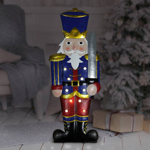 Hand Painted Nutcracker Soldier with LED Blue and Red Uniform on a Battery Powered Automatic Timer, 12 x 31 Inches | Exhart