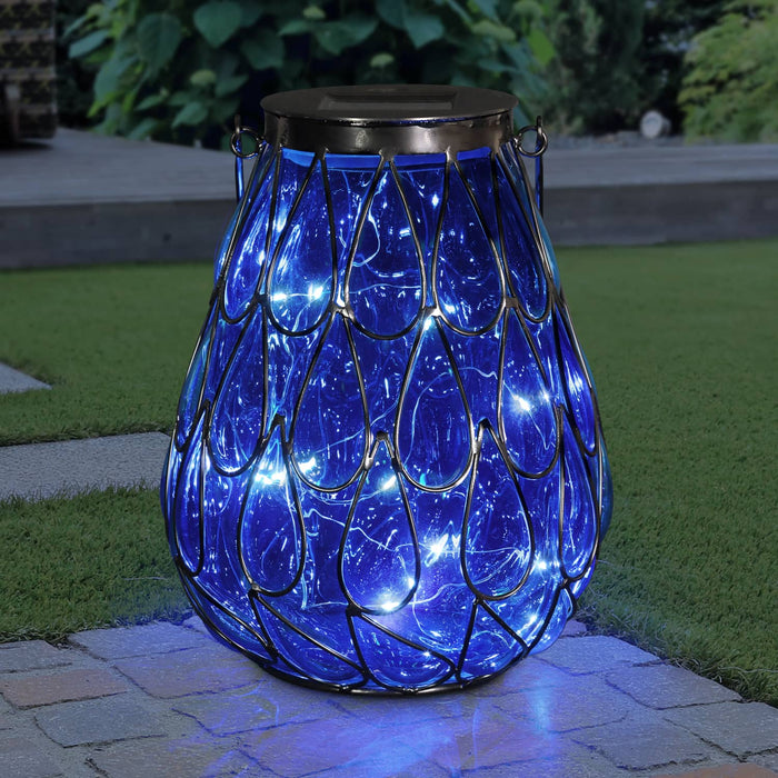 Solar Blue Glass in Caged Metal Tabletop Accent Lantern with 25 Firefly LEDs, 7"x9"