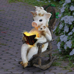 Solar Pig Reading a Story in a Rocking Chair Garden Statue, 12 Inch | Shop Garden Decor by Exhart
