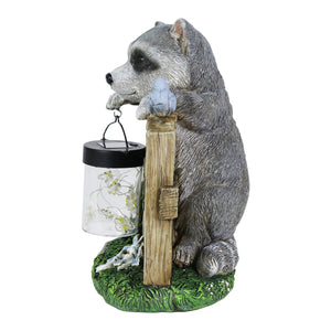 Solar Hand Painted Raccoon Garden Statue with a Lantern Jar of LED Bumblebees by a Welcome Fence, 9 by 10.5 Inches | Exhart