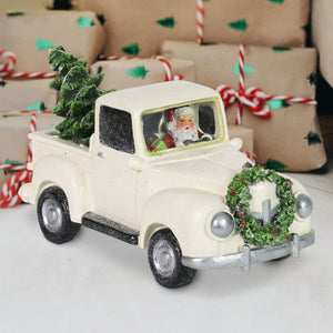 Vintage White Holiday Truck Driven by Santa with a Christmas Tree Statuary on a Battery Powered Timer, 12 x 6  Inches | Exhart