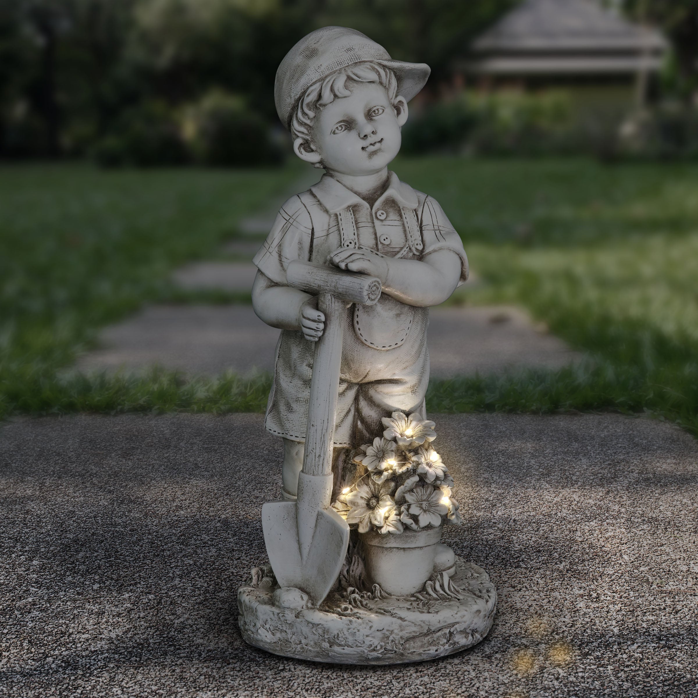 Solar Gardening Boy Statue in Natural Resin Finish