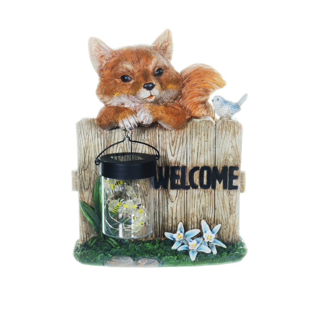 Solar Hand Painted Fox Garden Statue with a Lantern Jar of LED Bumblebees by a Welcome Fence, 9.5 by 11 Inches