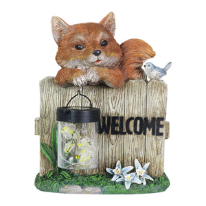 Solar Hand Painted Fox Garden Statue with a Lantern Jar of LED Bumblebees by a Welcome Fence, 9.5 by 11 Inches | Exhart