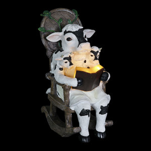 Solar Cow Family Reading a Story in a Rocking Chair Garden Statue, 12 Inch | Shop Garden Decor by Exhart